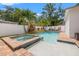 Backyard features a sparkling pool, spa, and privacy fence; perfect for entertaining and relaxing at 1436 30Th N Ave, St Petersburg, FL 33704