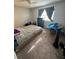 Bedroom with carpet and natural light through a window at 144 Douglas W Rd # F, Oldsmar, FL 34677