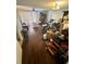 Living room with ceiling fan, neutral paint, blinds on window, and wood-look vinyl flooring at 144 Douglas W Rd # F, Oldsmar, FL 34677