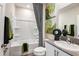 Clean bathroom with tub, shower, modern fixtures, and stylish decor, creating a spa-like atmosphere at 14807 Summer Branch Dr, Lithia, FL 33547