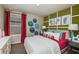 This bedroom features eclectic wall decor and bold colors for a fun, playful design at 14807 Summer Branch Dr, Lithia, FL 33547