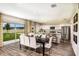 Dining area with a modern table, chairs, and sliding glass doors to the backyard at 14807 Summer Branch Dr, Lithia, FL 33547