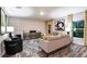 Stylish living room with modern decor, patterned rug, and plenty of natural light at 14807 Summer Branch Dr, Lithia, FL 33547