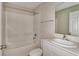 Neutral bathroom with a shower-tub combo, and vanity with a modern sink and fixture at 14815 Summer Branch Dr, Lithia, FL 33547