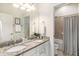 Beautiful bathroom with double sinks, granite countertops and a tub with shower at 1512 Banner Elk St, Valrico, FL 33594