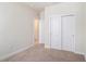 The bedroom features carpet floors and double door closets at 1512 Banner Elk St, Valrico, FL 33594