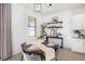 Cozy dining room features modern lighting, and a round wooden table set for four at 1512 Banner Elk St, Valrico, FL 33594