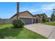 A single story home is shown featuring a three car garage and well maintained lawn and landscaping at 1512 Banner Elk St, Valrico, FL 33594