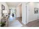 Bright foyer with light wood floors, modern decor, and an open view to the living space at 1512 Banner Elk St, Valrico, FL 33594