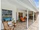 Beautiful backyard featuring a covered patio, screened-in pool, and lush landscaping, perfect for outdoor living at 160 Sage Cir, Crystal Beach, FL 34681