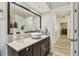 Updated bathroom featuring a modern vanity with vessel sink, large mirror and hallway entry at 160 Sage Cir, Crystal Beach, FL 34681
