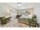 Bright bedroom with green walls, wood-look floors, and a ceiling fan at 160 Sage Cir, Crystal Beach, FL 34681