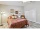 Bedroom with a ceiling fan, wood-look floors, closet, and natural light at 160 Sage Cir, Crystal Beach, FL 34681