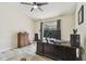 Bedroom with ceiling fan, wood floors, and a window at 160 Sage Cir, Crystal Beach, FL 34681