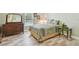 Bedroom featuring wood-look floors, a ceiling fan, and natural light at 160 Sage Cir, Crystal Beach, FL 34681