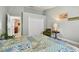 Bright bedroom with green walls, wood-look floors, and natural light at 160 Sage Cir, Crystal Beach, FL 34681