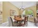 Cozy dining room with vaulted ceilings and decorative chandelier lighting at 160 Sage Cir, Crystal Beach, FL 34681