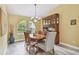 Charming dining area featuring a decorative cabinet and arch window at 160 Sage Cir, Crystal Beach, FL 34681