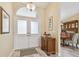 Bright entryway features double doors, wood flooring, and decorative accents at 160 Sage Cir, Crystal Beach, FL 34681