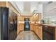 Well-equipped kitchen with ample wood cabinetry and modern appliances, offering a functional and stylish cooking space at 160 Sage Cir, Crystal Beach, FL 34681