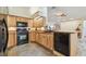 Well-equipped kitchen with ample wood cabinetry and modern appliances, offering a functional and stylish cooking space at 160 Sage Cir, Crystal Beach, FL 34681