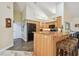 Kitchen with breakfast bar seating and black appliances, offering casual dining and a modern cooking space at 160 Sage Cir, Crystal Beach, FL 34681