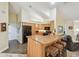 Kitchen with breakfast bar seating and black appliances, offering casual dining and a modern cooking space at 160 Sage Cir, Crystal Beach, FL 34681