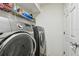 Laundry room with front loading washer and dryer at 160 Sage Cir, Crystal Beach, FL 34681