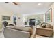 Inviting living room with comfortable leather seating and a flat-screen TV, perfect for relaxation and entertainment at 160 Sage Cir, Crystal Beach, FL 34681