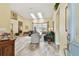 Spacious living room with hardwood floors, skylights, and abundant natural light at 160 Sage Cir, Crystal Beach, FL 34681