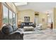 Bright living room with sliding glass doors and comfortable seating arrangement at 160 Sage Cir, Crystal Beach, FL 34681