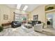Bright living room with vaulted ceiling, comfortable seating, and view to pool at 160 Sage Cir, Crystal Beach, FL 34681