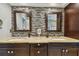 The main bathroom showcases double sinks, granite countertops, and a stylish mosaic backsplash at 160 Sage Cir, Crystal Beach, FL 34681