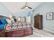 Bright main bedroom featuring a ceiling fan, vaulted ceiling, and modern decor at 160 Sage Cir, Crystal Beach, FL 34681