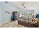 Bright main bedroom with pool access, a comfortable bed, and serene decor for a relaxing retreat at 160 Sage Cir, Crystal Beach, FL 34681
