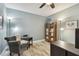 Comfortable office space featuring a cozy armchair, shelving and soothing wall color at 160 Sage Cir, Crystal Beach, FL 34681