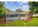 An exterior shot of the screened-in pool and spa with well-maintained landscaping at 160 Sage Cir, Crystal Beach, FL 34681