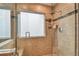 Modern shower with glass enclosure, frosted window, tiled walls, and recessed niche at 160 Sage Cir, Crystal Beach, FL 34681