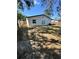 Spacious backyard with white house, wooden fence and ample space at 1778 New Hampshire Ne Ave, St Petersburg, FL 33703