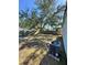 Large backyard with a large shade tree and AC unit at 1778 New Hampshire Ne Ave, St Petersburg, FL 33703