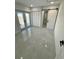Bright bedroom with French doors, closet, and access to an ensuite bathroom via sliding barn door at 1778 New Hampshire Ne Ave, St Petersburg, FL 33703