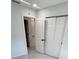 Bedroom with a closet and a door leading to an ensuite bathroom with marble tile flooring at 1778 New Hampshire Ne Ave, St Petersburg, FL 33703