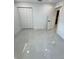 Bedroom with a closet, a door leading to an ensuite bathroom, and marble tile flooring at 1778 New Hampshire Ne Ave, St Petersburg, FL 33703