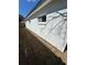 Exterior view of a home with fresh landscaping and a freshly painted white exterior at 1778 New Hampshire Ne Ave, St Petersburg, FL 33703