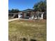 Charming one-story home with a well-maintained lawn and mature palm tree at 1778 New Hampshire Ne Ave, St Petersburg, FL 33703