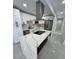 Beautiful updated kitchen with quartz countertops, stainless steel appliances, and island at 1778 New Hampshire Ne Ave, St Petersburg, FL 33703