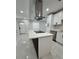 A kitchen features an island cooktop, custom cabinets, and stainless steel appliances at 1778 New Hampshire Ne Ave, St Petersburg, FL 33703