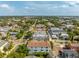 Wide aerial shot showcases the surrounding neighborhood and nearby city skyline at 2110 W Azeele St, Tampa, FL 33606