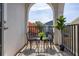 Cozy balcony with outdoor seating, and views of neighboring homes and blue skies at 2110 W Azeele St, Tampa, FL 33606