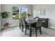 Dining room with modern decor, a dark wood dining table and ample sunlight at 2110 W Azeele St, Tampa, FL 33606